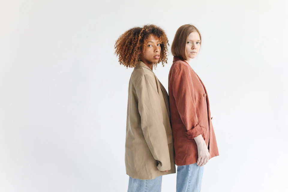 Two models wearing coordinated fashion jackets